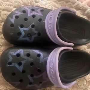 CROCS Kids Black Clogs with Purple Star Accents